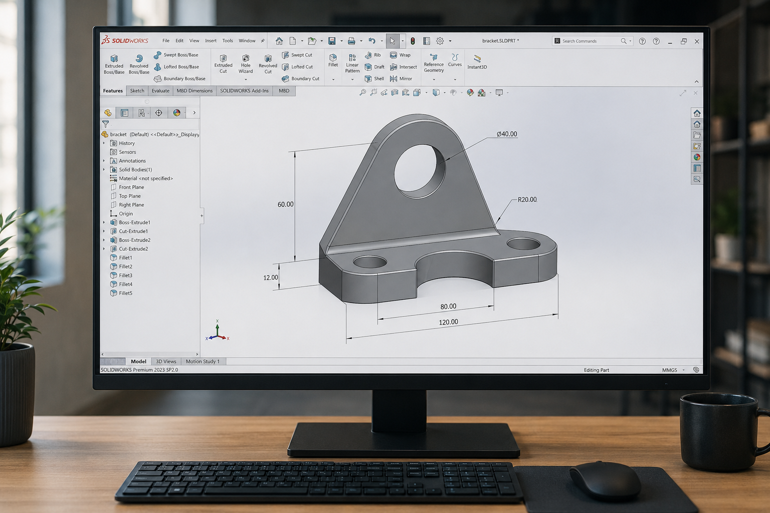 CAD software displaying a machined bracket part with dimension callouts on a desktop monitor
